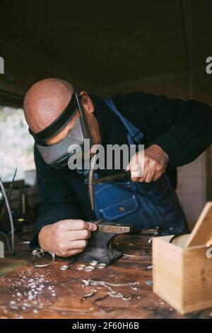 Male welder working in workshop Stock Photo