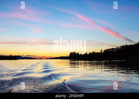 Sunset over the copeland Islands from a boat from Lund on the strait of Georgia Stock Photo