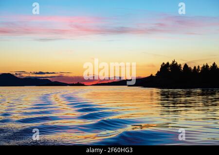 Sunset over the copeland Islands from a boat from Lund on the strait of Georgia Stock Photo