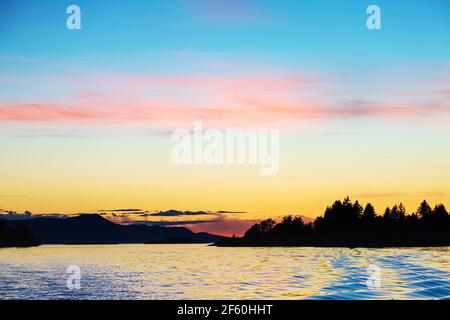 Sunset over the copeland Islands from a boat from Lund on the strait of Georgia Stock Photo