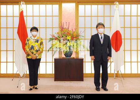 March 29, 2021, Tokyo, Japan: TOKYO, JAPAN - MARCH 29 : Toshimitsu Motegi, Japan's foreign minister, and Indonesian Foreign Minister Retno Marsudi, wearing protective face masks, pose for a photograph prior to the Japan-Indonesia Foreign Ministers meeting in Tokyo, Japan, on Monday, March 29, 2021. Indonesian Foreign Minister Retno Marsudi and Defense Minister Prabowo Subianto are in Japan from March 28-30, 2021. Retno and Prabowo will also hold a second 2 and 2 meeting between Foreign Ministers and Defense Ministers of two countries on Tuesday, March 30, 2021. The two countries will enter iss Stock Photo