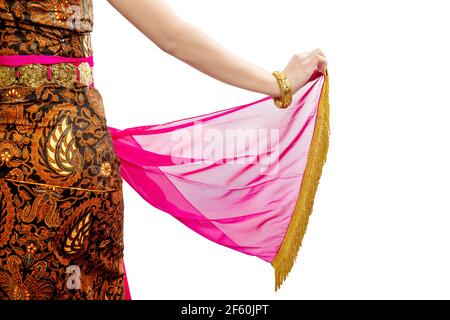 Woman dancing Javanese traditional dance isolated over white background Stock Photo