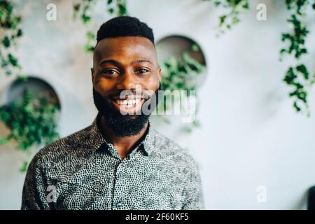 Portrait of smiling businessman in office Stock Photo