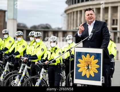 Berlin, Germany. 29th Mar, 2021. Andreas Geisel (SPD), Senator for the Interior and Sport, speaks during a press conference of the Berlin police to present the new bicycle lanes in front of the Olympic Stadium. Credit: Fabian Sommer/dpa/Alamy Live News Stock Photo
