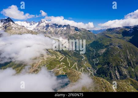Aerial view of the Grimsel and Furka mountain pass in the alps between cantons of Bern, Valais and Uri in Switzerland on a sunny summer day Stock Photo