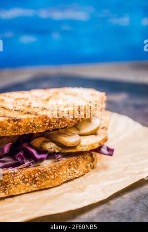Freshly cooked sandwiches with roasted chicken, purple cabbage and mushrooms. Selective focus. Shallow depth of field. Stock Photo