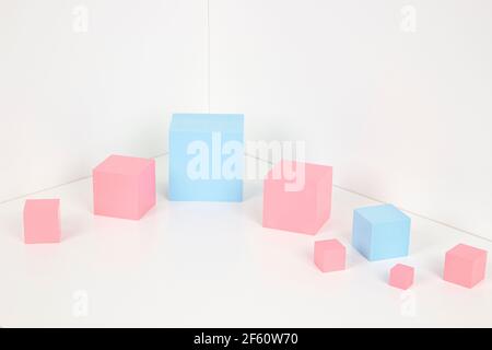 Light blue and pink cubes, platforms on white background with copy space for product or text. Stock Photo