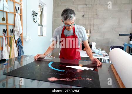 Paintbrushes, artist palette, oil paints on desk in painter studio. Close  up Stock Photo - Alamy