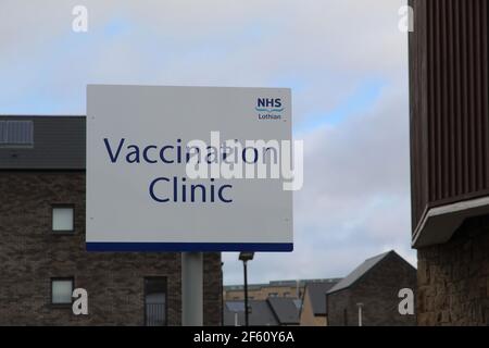 NHS Lothian Covid-19 Vaccination Clinic Road Sign Outside Sighthill Health Centre in Edinburgh Stock Photo