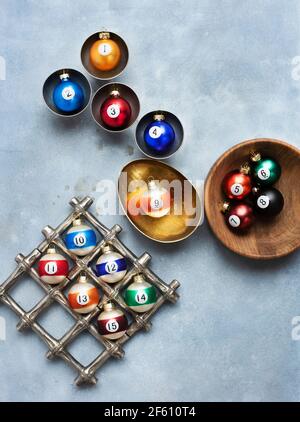 Christmas ornaments in gold, wood and silver bowls Stock Photo