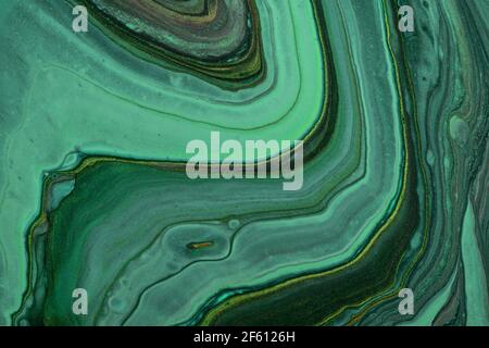 Abstract fluid art background dark green and black glitter colors. Liquid marble. Acrylic painting on canvas with emerald gradient. Watercolor backdro Stock Photo