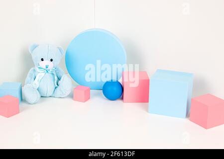Composition of colorful educational baby kid toys and geometric shapes cubes, podiums, platforms on white background Stock Photo