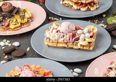 Three different waffles in square, heart and bubble shape. Stock Photo