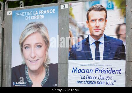 REYRIEUX, FRANCE - APRIL 15, 2017 : Official campaign posters for the 2017 french presidential election, Marine Le Pen and Emmanuel Macron. Stock Photo