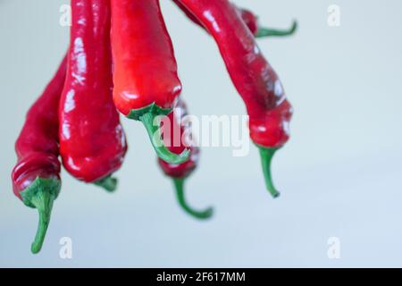 Group of red hot chili peppers hanging upside down Stock Photo