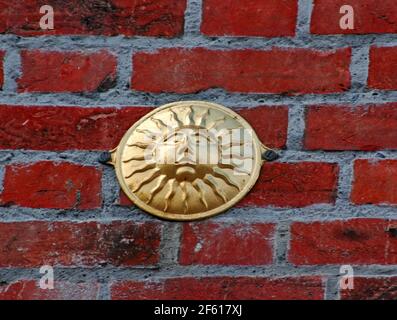 Sun firemark on outside wall of building in Chichester, West Sussex ...