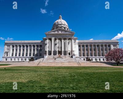 View of front entrance to Missouri State Capitol building that houses Missouri General Assembly and executive branch of government with blue sky and g Stock Photo