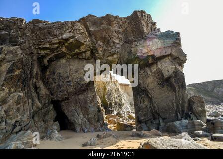 A rock arch on the wild coast of France near Quiberon. Stock Photo