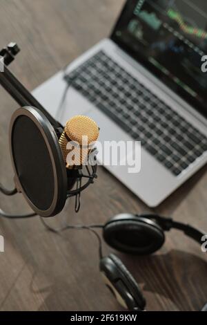 Close-up of audio equipments on the wooden table in recording studio Stock Photo