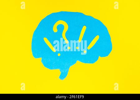 problem concept, blue brain layout with question and exclamation marks on yellow background Stock Photo