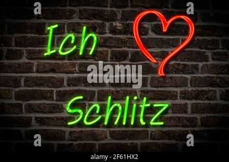 Leuchtreklame, Ich liebe Schlitz, Hessen, Deutschland, Europa | Illuminated advertising, I love Schlitz, Hesse, Germany, Europe Stock Photo