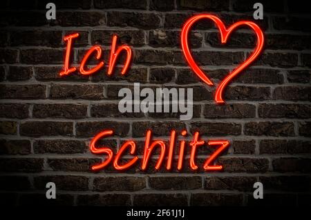 Leuchtreklame, Ich liebe Schlitz, Hessen, Deutschland, Europa | Illuminated advertising, I love Schlitz, Hesse, Germany, Europe Stock Photo