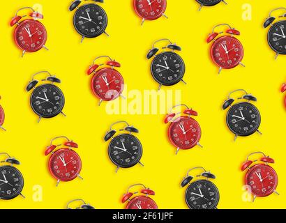 Many alarm clocks on color background Stock Photo