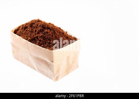 Ground beans of organic coffee in paper bag - Coffea Stock Photo