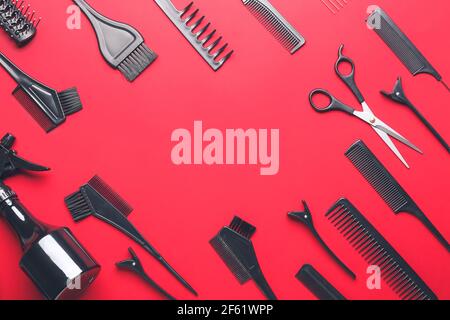 Frame made of hairdresser's tools on color background Stock Photo