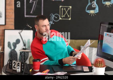 Male designer working in office Stock Photo