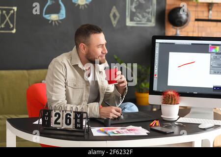 Male designer working in office Stock Photo
