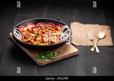 Kerala style Prawns roast or chemmeen varattiyathu  made using red kashmiri chilli flakes and coconut slices as main ingrediants and garnished with on Stock Photo