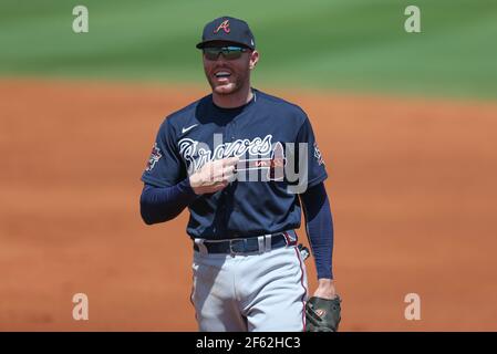 Atlanta Braves first baseman Freddie Freeman and New York Yankees  outfielder Aaron Judge share a laugh at first base with Freeman giving him  a pat on the shoulder after Judge hit a