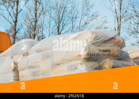 Belarus, Minsk - December 19, 2019: The car transports bags of concrete and gravel mix, transportation in the city. Stock Photo