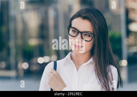 Photo of young attractive beautiful charming confident businesswoman in glasses look copyspace outside outdoor Stock Photo