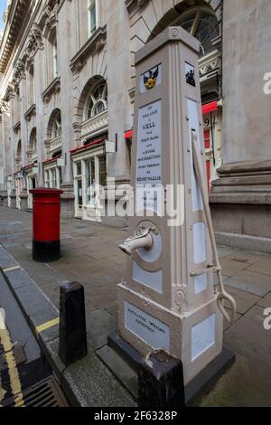 City of London England UK March 2021 The site of a WELL originating from 1282. By the roadside, on the pavement directly outside the south-east corner Stock Photo