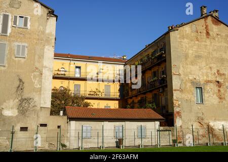 Milan, Lombardy, Italy: old typical residential buildings at Biblioteca degli Alberi park Stock Photo