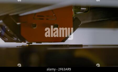 Three dimensional printing machine prints physical flat 3D model at factory Stock Photo