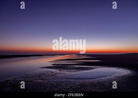 Tidal pools on Talacre beach at dawn, North Wales coast Stock Photo