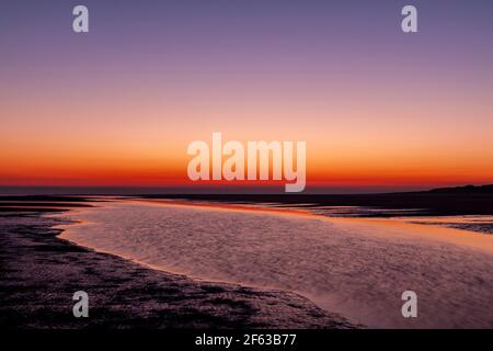 Tidal pools on Talacre beach at dawn, North Wales coast Stock Photo