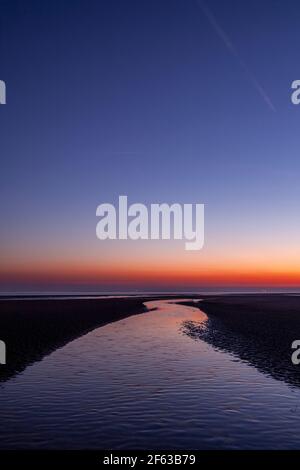 Tidal pools on Talacre beach at dawn, North Wales coast Stock Photo