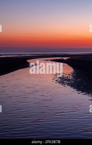 Tidal pools on Talacre beach at dawn, North Wales coast Stock Photo