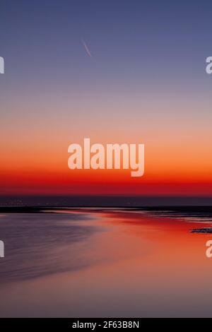 Tidal pools on Talacre beach at dawn, North Wales coast Stock Photo