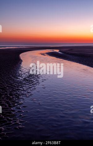 Tidal pools on Talacre beach at dawn, North Wales coast Stock Photo