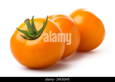 Three yellow tomatoes isolated on a white background Stock Photo