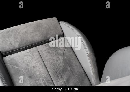 Modern luxury car black leather with alcantara interior. Part of black leather car seat details with white stitching. Interior of prestige car. Perfor Stock Photo