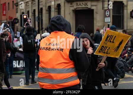 Kill the Bill protest Manchester, UK during the national lockdown in England. Legal observer and protester at sit in with Kill the Bill placard Stock Photo