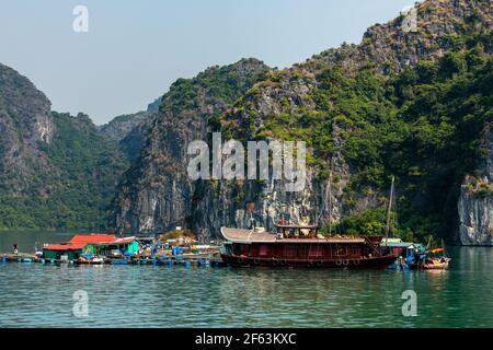 Floating Village and Fisher of the Halong Bay in Vietnam Stock Photo