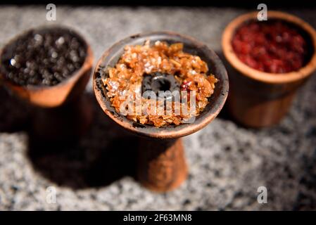 Clay bowl for hookah with tobacco and accessories for making hookah Stock  Photo - Alamy