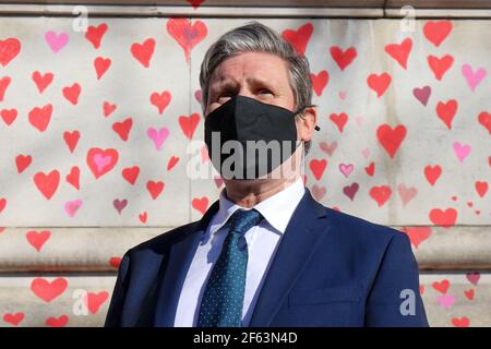 LONDON, UK. MARCH 29TH: Labour Leader Keir Starmer Visits The National Covid-19 Memorial Wall on London's South Bank opposite The Houses of Parliament, each red heart represents one of the 150,000 victims who have died during the Pandemic pictured on Monday 29th March 2021. (Credit: Lucy North | MI News) Credit: MI News & Sport /Alamy Live News Stock Photo